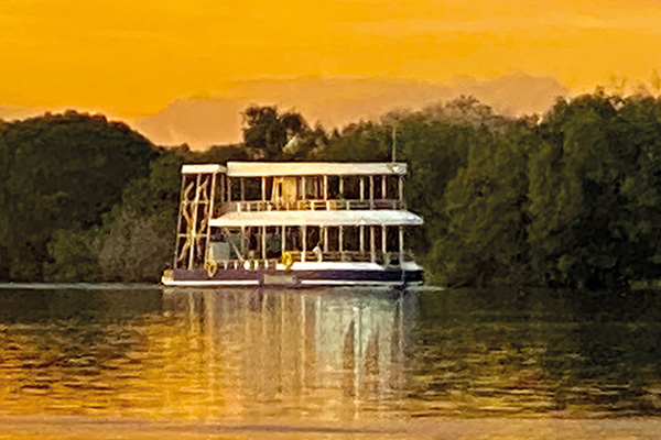 Zambezi River Sunset Cruise Victoria Falls Zimbabwe Tourists enjoying sunset cruise on the Zambezi River near Victoria Falls, Zimbabwe arranged by Wild Bhiza